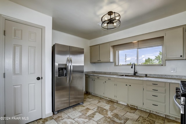 kitchen featuring stainless steel fridge and sink