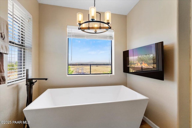 1445 S Table Mountain Rd, Chino Valley, AZ 86323 - bathroom with a chandelier and a freestanding bath