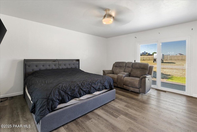 1445 S Table Mountain Rd, Chino Valley, AZ 86323 - bedroom featuring access to exterior, wood finished floors, ceiling fan, and baseboards