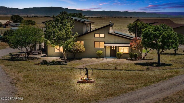 1445 S Table Mountain Rd, Chino Valley, AZ 86323 - view of front of home featuring a mountain view, stucco siding, and solar panels