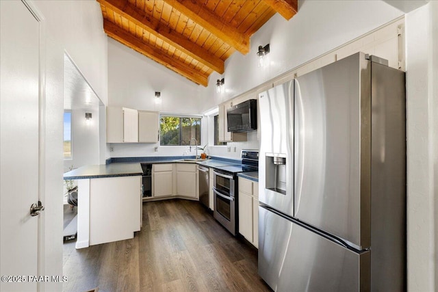 1445 S Table Mountain Rd, Chino Valley, AZ 86323 - kitchen featuring stainless steel appliances, wooden ceiling, dark countertops, a sink, and dark wood-type flooring