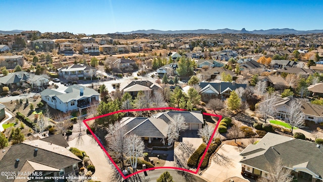 birds eye view of property featuring a mountain view