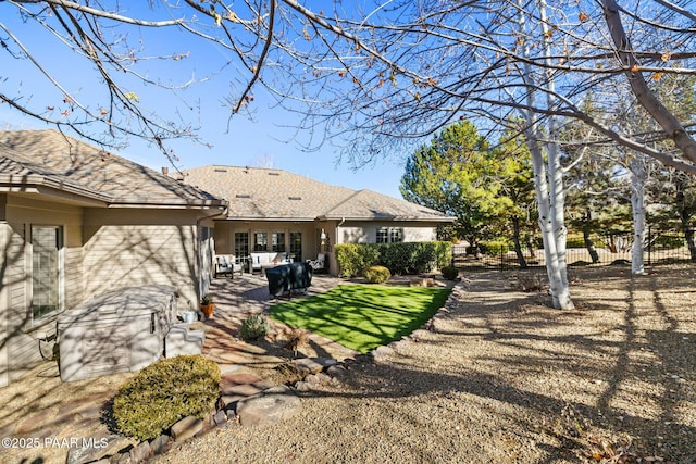 back of property featuring a patio