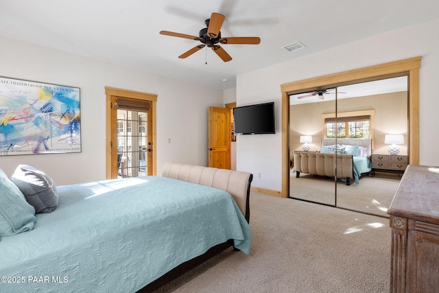 carpeted bedroom with access to exterior, a closet, and ceiling fan