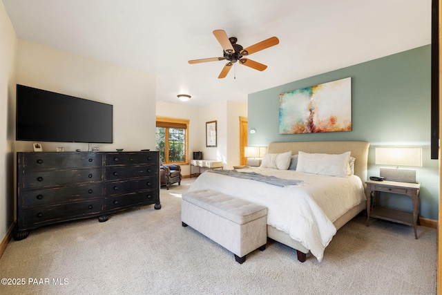 bedroom featuring ceiling fan and light colored carpet