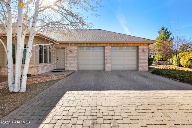 single story home featuring a garage