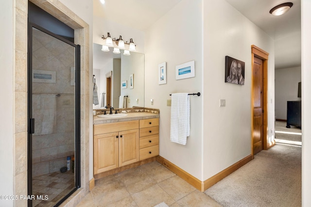 bathroom with tile patterned flooring, vanity, and an enclosed shower