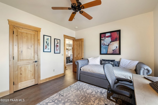 living room with ceiling fan and dark wood-type flooring