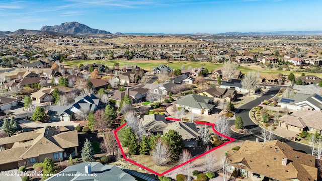 birds eye view of property featuring a mountain view