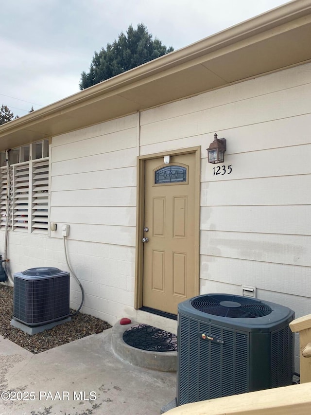 property entrance with central air condition unit