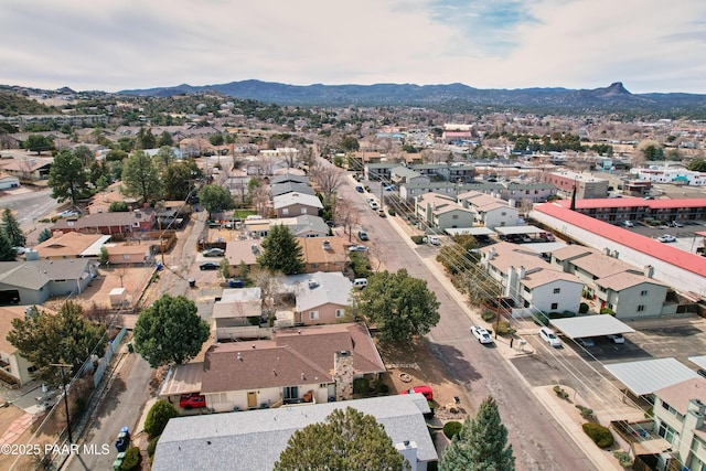 drone / aerial view featuring a residential view and a mountain view