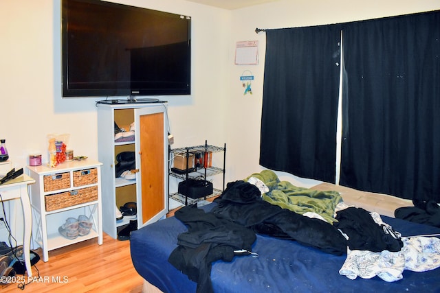 bedroom with light wood-type flooring