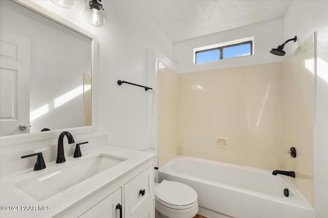 full bathroom with vanity, toilet, shower / tub combination, and a textured ceiling