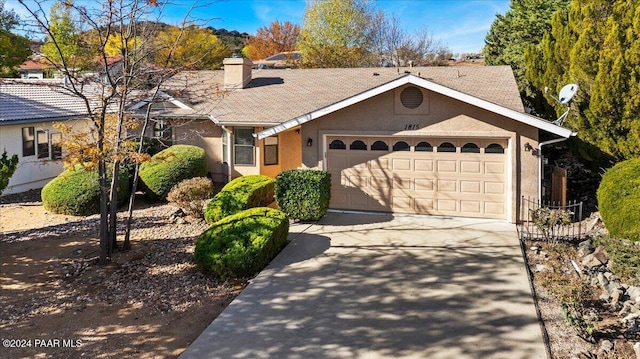 single story home with a garage