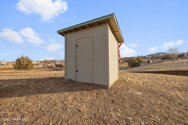 view of outbuilding featuring a rural view