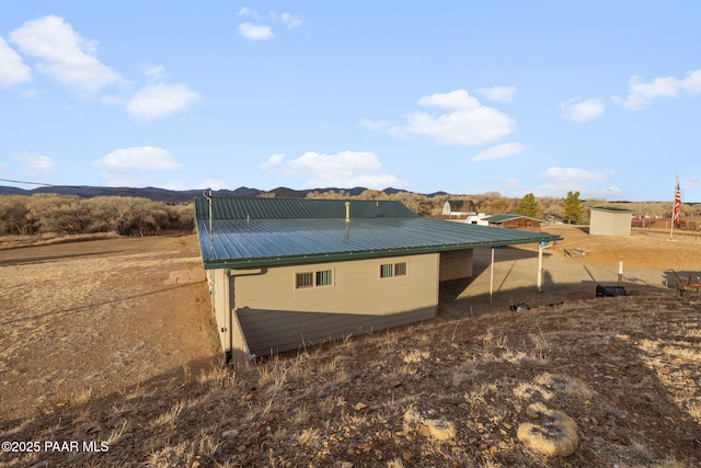 view of side of property featuring a mountain view