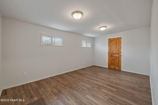 spare room with hardwood / wood-style floors