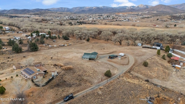 birds eye view of property with a mountain view