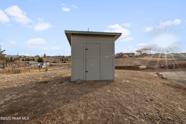 view of outdoor structure featuring a rural view