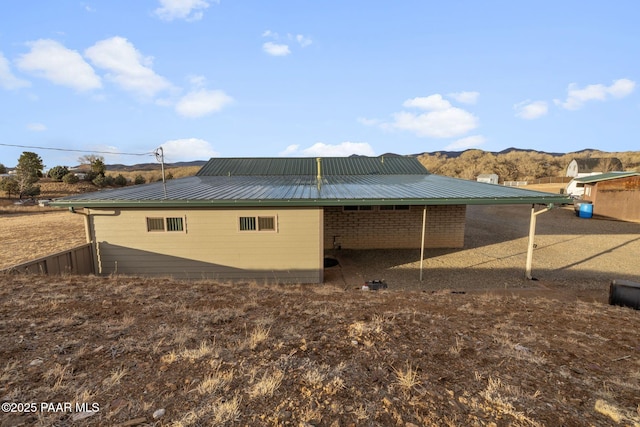 view of home's exterior featuring a mountain view