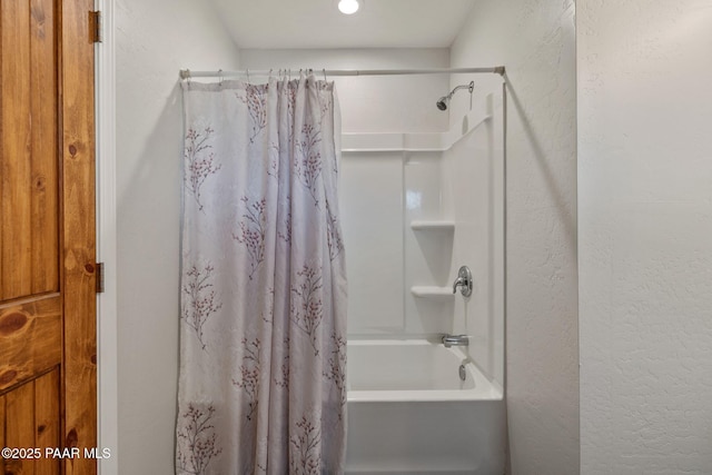 bathroom with shower / tub combo with curtain