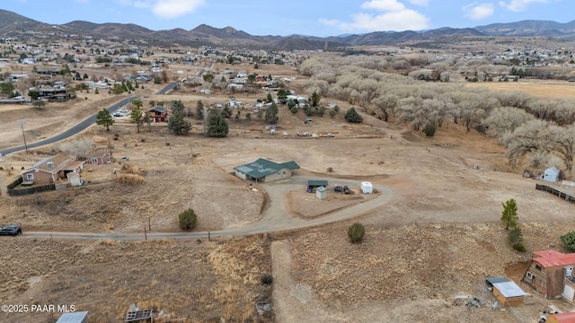 birds eye view of property featuring a mountain view