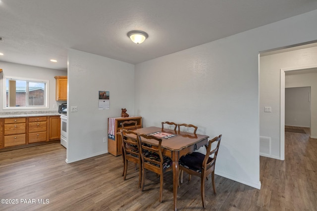 dining area with wood-type flooring