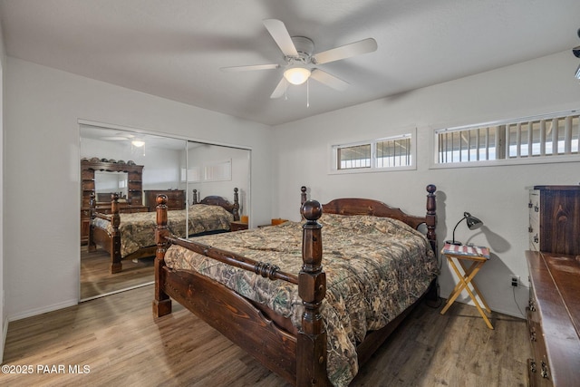 bedroom with wood-type flooring, a closet, and ceiling fan