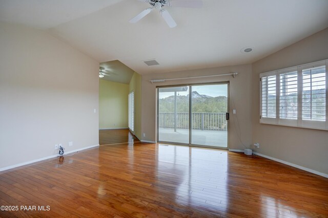 2312 Loma Vista Dr, Prescott, AZ 86305 - spare room featuring baseboards, lofted ceiling, a ceiling fan, and hardwood / wood-style flooring