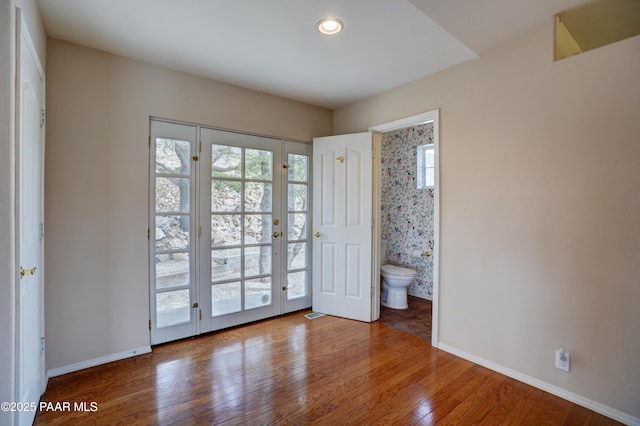 2312 Loma Vista Dr, Prescott, AZ 86305 - unfurnished bedroom featuring recessed lighting, connected bathroom, baseboards, and wood finished floors
