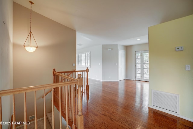 2312 Loma Vista Dr, Prescott, AZ 86305 - hall with wood finished floors, plenty of natural light, an upstairs landing, and visible vents