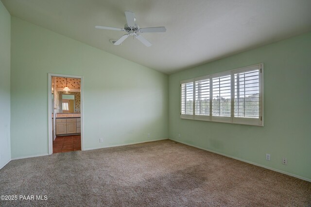 2312 Loma Vista Dr, Prescott, AZ 86305 - unfurnished bedroom featuring connected bathroom, baseboards, carpet, lofted ceiling, and ceiling fan