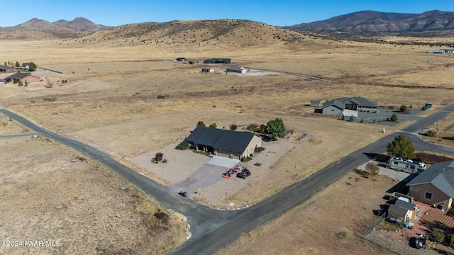 birds eye view of property with a mountain view