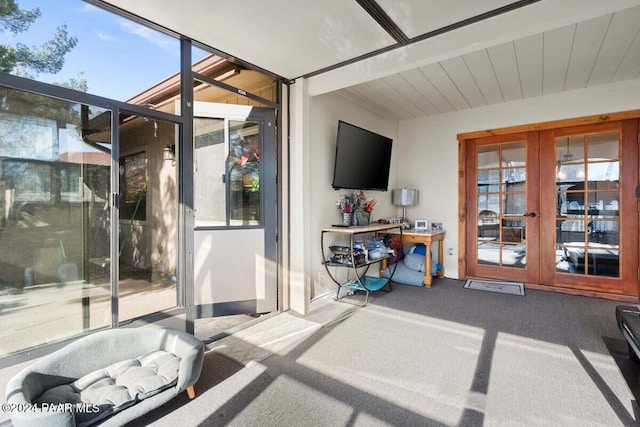 sunroom / solarium featuring plenty of natural light and french doors