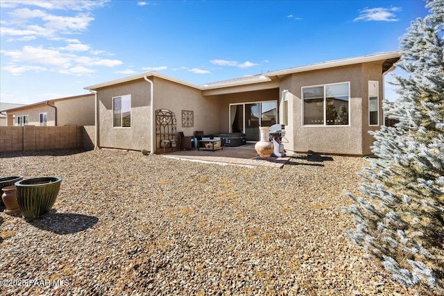 rear view of house featuring a patio