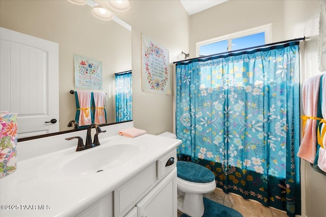 full bathroom with shower / bath combination with curtain, vanity, toilet, and tile patterned floors