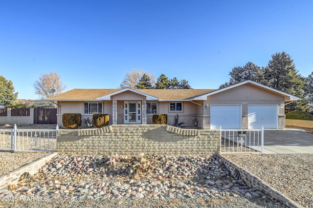 ranch-style house featuring a garage