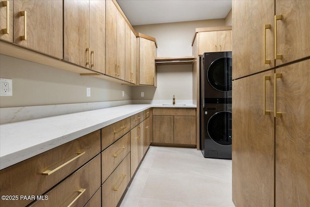 5285 High Cliff Way, Prescott, AZ 86301 - kitchen featuring light stone counters, sink, and stacked washer / dryer