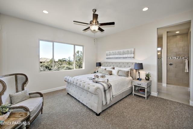 carpeted bedroom featuring ensuite bath and ceiling fan