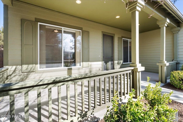 view of exterior entry featuring a porch