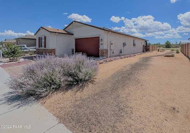 view of property exterior with a garage