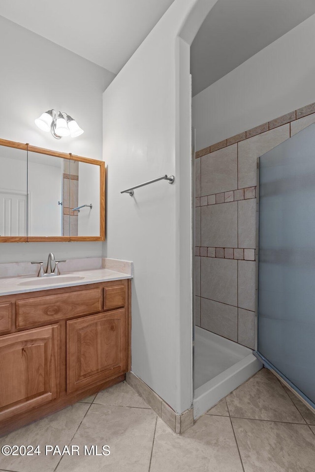 11645 E Prescott Dells Rnch Rd, Dewey-Humboldt, AZ 86327 - bathroom with tile patterned flooring, vanity, and tiled shower