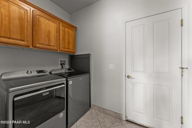 11645 E Prescott Dells Rnch Rd, Dewey-Humboldt, AZ 86327 - laundry area with cabinets, light tile patterned flooring, and washing machine and clothes dryer