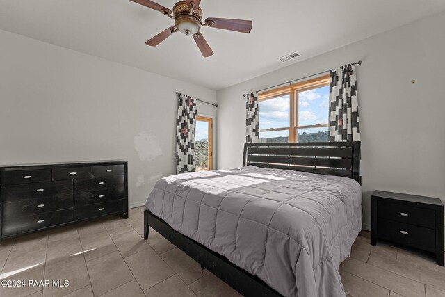 11645 E Prescott Dells Rnch Rd, Dewey-Humboldt, AZ 86327 - tiled bedroom featuring ceiling fan