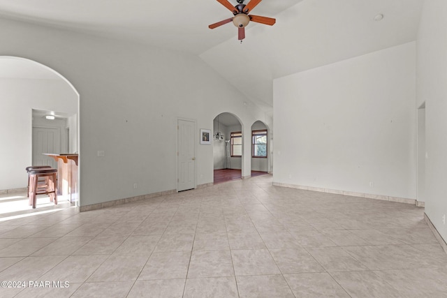 11645 E Prescott Dells Rnch Rd, Dewey-Humboldt, AZ 86327 - unfurnished living room featuring high vaulted ceiling, ceiling fan, and light tile patterned flooring