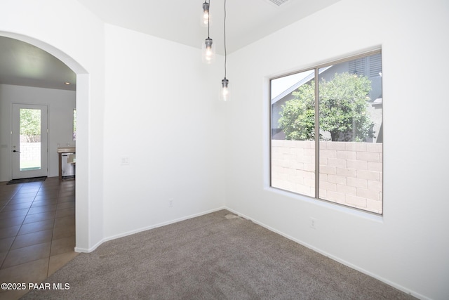 6560 E Brombil St, Prescott Valley, AZ 86314 - spare room with arched walkways, carpet floors, and baseboards
