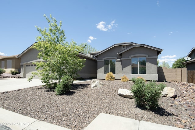 6560 E Brombil St, Prescott Valley, AZ 86314 - ranch-style house featuring stucco siding, fence, concrete driveway, and a garage