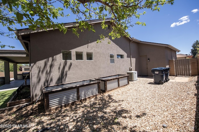 6560 E Brombil St, Prescott Valley, AZ 86314 - view of side of home featuring stucco siding, cooling unit, fence, and a patio