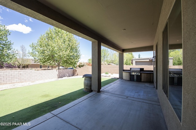 6560 E Brombil St, Prescott Valley, AZ 86314 - view of patio featuring a fenced backyard and exterior kitchen