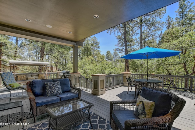 1021 Sheriffs Posse Trl, Prescott, AZ 86303 - wooden terrace with outdoor lounge area, outdoor dining space, and view of scattered trees
